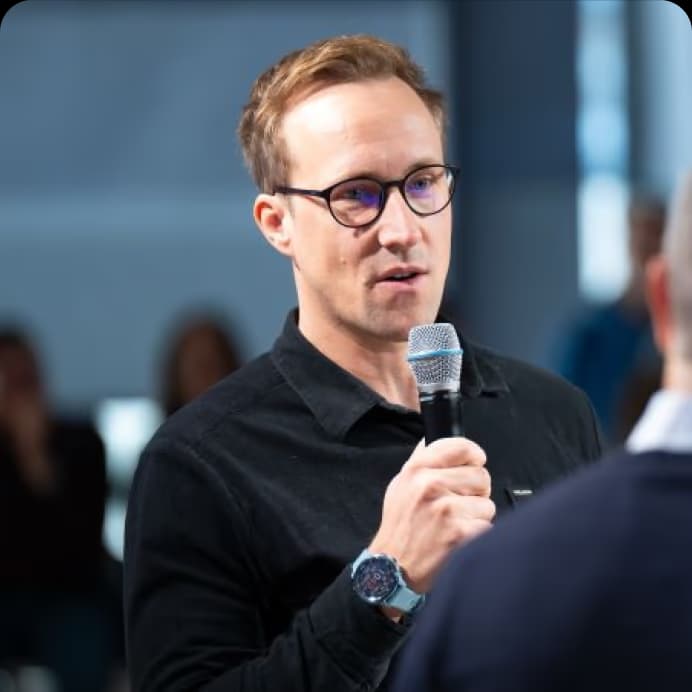Ivo Beyer, Head of Sustainability at Vodafone, speaking on stage