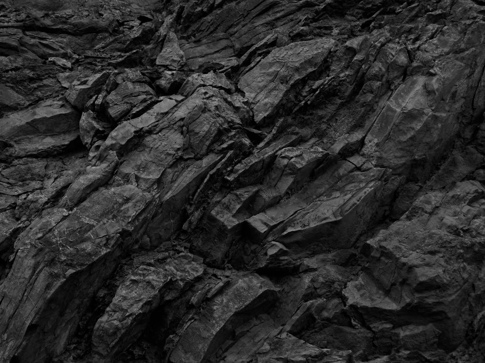 Dark volcanic rock face